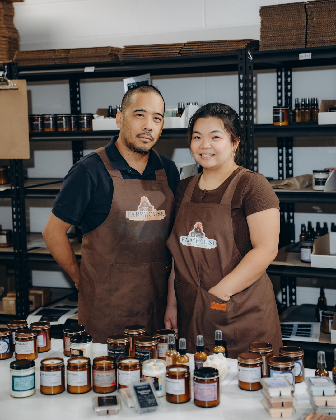 Farmhouse Charm Candle Company founders The founders of Farmhouse Charm Candle Company in their workshop, surrounded by their handmade candles