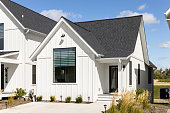 White Home Exterior with Black Roof