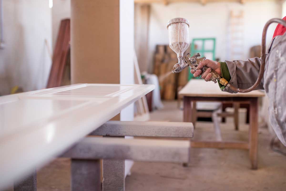 flat line spray coating a wood cabinet components