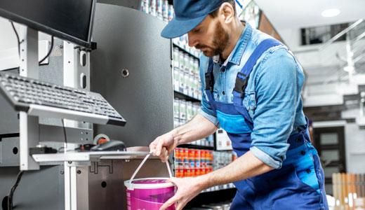 Cloverdale Paint team member mixing paint, highlighting a hands-on, fast-paced career environment.